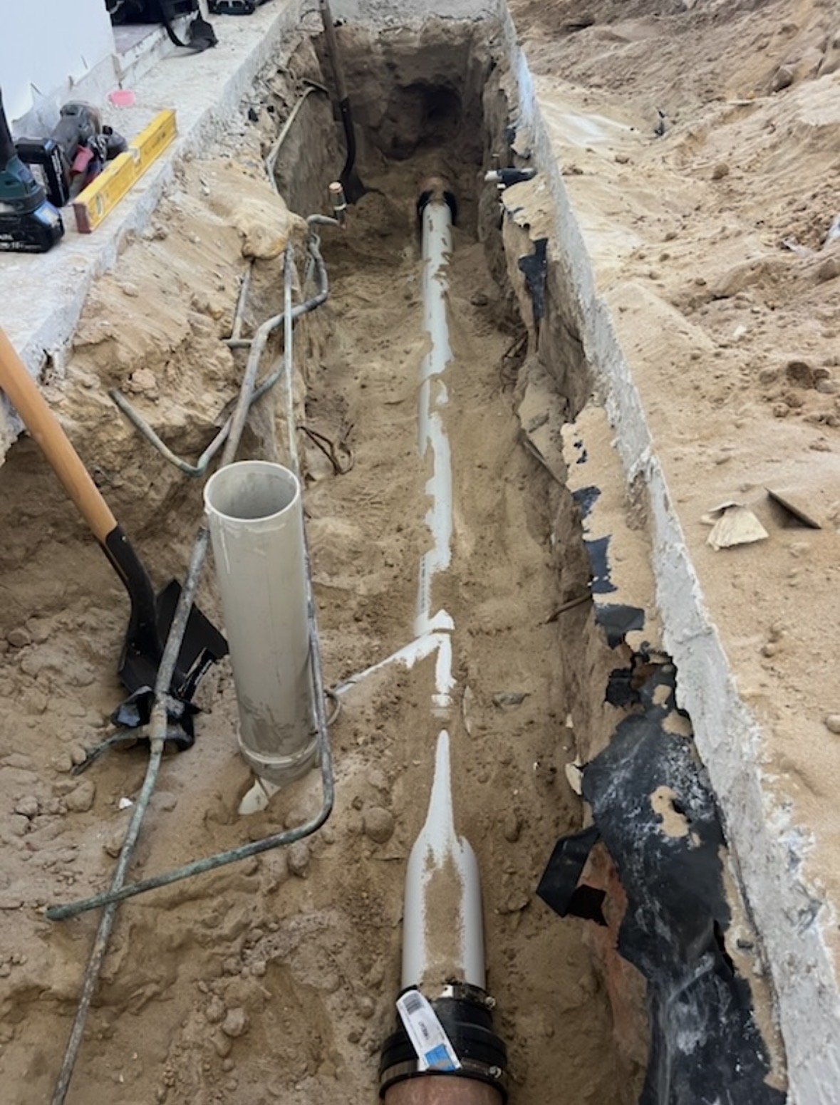 Underground drainage pipe repair in excavated trench by Plumbforce WA